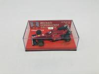 FERRARI: A 1:43 scale model by Minichamps of the F310 in Michael Schumacher livery, in original packaging [Location: Sydney] - 2