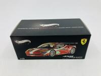 FERRARI: A 1:43 scale model by Hot Wheels of the 458 Italia GT2 in AF Corse 2011 Le Mans livery, in original packaging [Location: Sydney] - 2
