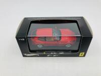 FERRARI: A 1:43 scale model by Hot Wheels of the FF, in original packaging [Location: Sydney] - 2