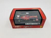 FERRARI: A 1:43 scale model by Hot Wheels of the F138, in original packaging [Location: Sydney] - 2
