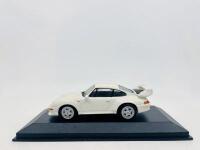PORSCHE: A 1:43 scale model by Minichamps of the 1995 Porsche 911 (993) GT, complete with original packaging [Location: Sydney]