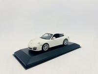 PORSCHE: A 1:43 scale model by Minichamps of the Porsche 911 (997) Carrera 4S, complete with original packaging [Location: Sydney] - 2