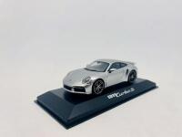 PORSCHE: A 1:43 scale model by Minichamps of the Porsche 911 (992) Turbo S, complete with original packaging [Location: Sydney] - 2