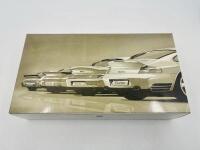 PORSCHE: A box set of 1:43 scale models by Minichamps featuring four generations of the 911 Turbo (930, 964, 993 and 996), limited edition 1 of 5000 pieces&nbsp;, complete with original packaging [Location: Sydney]