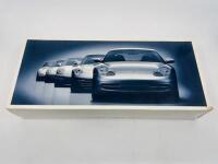 PORSCHE: A box set of 1:43 scale models by Minichamps and Schuco&nbsp;featuring five generations of the 911&nbsp;(1964, 1974, 1990, 1994&nbsp;and 1997), limited edition 1 of 5000 pieces , complete with original packaging [Location: Sydney]
