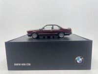 BMW: A 1:43 scale model by BMW of the BMW 635CSi, complete with original packaging. [Location: Sydney]