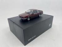 BMW: A 1:43 scale model by BMW of the BMW 635CSi, complete with original packaging. [Location: Sydney] - 2