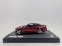 BMW: A 1:43 scale model by BMW of the BMW M4, complete with original packaging. [Location: Sydney]
