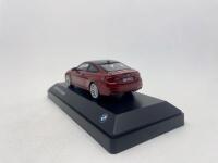 BMW: A 1:43 scale model by BMW of the BMW M4, complete with original packaging. [Location: Sydney] - 3