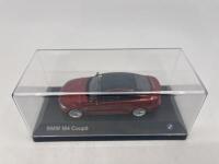 BMW: A 1:43 scale model by BMW of the BMW M4, complete with original packaging. [Location: Sydney] - 5