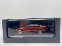 BMW: A 1:43 scale model by BMW of the BMW M4, complete with original packaging. [Location: Sydney] - 7
