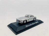 MERCEDES-BENZ: A 1:43 scale model by Schuco of the Mercedes-Benz 300 SL, complete with original packaging [Location: Sydney] - 2