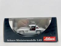 MERCEDES-BENZ: A 1:43 scale model by Schuco of the Mercedes-Benz 300 SL, complete with original packaging [Location: Sydney] - 8