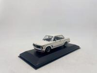 BMW: A 1:43 scale model by Minichamps of the 1973-74&nbsp;BMW 2002 Turbo,&nbsp;complete with original packaging. [Location: Sydney] - 2