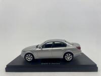 BMW: A 1:43 scale model by Kyosho of the BMW 545i Sedan, complete with original packaging. [Location: Sydney]