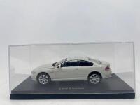 BMW: A 1:43 scale model by Kyosho of the BMW 6 Series Coupe, complete with original packaging. [Location: Sydney] - 6
