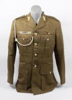 OFFICERS JACKET: A military dress jacket thought to be an ADF officers dress jacket, labelled 'JAMES' above right pocket, four pocket, four buttons, made by Evers & Cohen Sydney