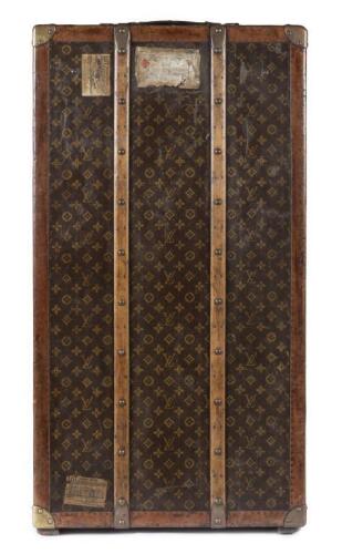 LOUIS VUITTON: An early 20th century Louis Vuitton monogram print wardrobe trunk, 33cm high, 101cm wide, 55cm deep