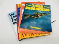 AVIATION BOOKS: Four publications relating to Aviation including 'Tiger Squadrons' by Tim Laming, 'The International Directory of Military Aircraft: 1996-1997' by Gerard Frawley and Jim Thorn, 'Military Aviation' and 'The American Fighter Plane' by Amy E.