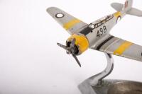 R.A.A.F. ASHTRAY: An RAAF ash tray, features a WWII era aircraft with RAAF roundels on stand attached to ash tray base, 11cm high, 19cm wide - 2
