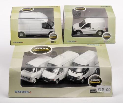 FORD TRANSITS: Three 1:76 scale Oxford models including a Ford Transit Connect White, White Transit LWD High and a Ford Transit 50th Anniversary