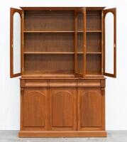 BOOK CASE: A two tiered timber bookcase by Pfitzner Furniture South Australia, featuring glazed display cabinetry, with a drawer and storage space to the lower, 137cm wide, 207cm high, 47cm deep - 2
