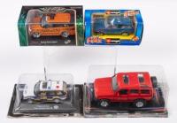 MODELS: A group of four Land Rover models in original packaging