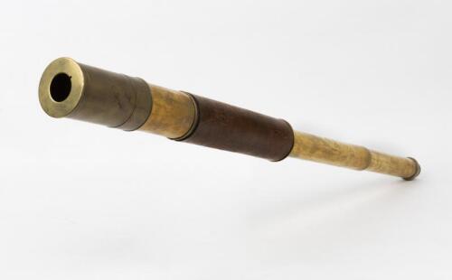 TELESCOPE: An antique brass and leather bound telescope