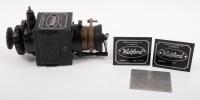 WATFORD&nbsp;MAGNETO: A Watford&nbsp;North & Sons Ltd Magneto No.91909, thought to possibly suit a Rolls-Royce 20/25 Hp model, with cog drive, 9cm high, 20cm long, also included is two Watford magneto nameplates
