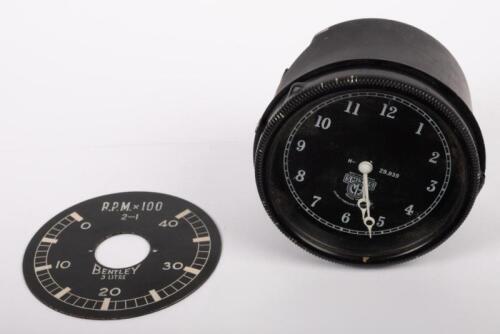 BENTLEY: A Smiths wind-up car clock thought to suit a 3 Litre Bentley model, 9cm in diameter, untested and also a RPM gauge dial plate for same model