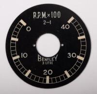 BENTLEY: A Smiths wind-up car clock thought to suit a 3 Litre Bentley model, 9cm in diameter, untested and also a RPM gauge dial plate for same model - 3