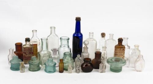 BOTTLES: A collection of small bottles. Medicine, perfume bottles