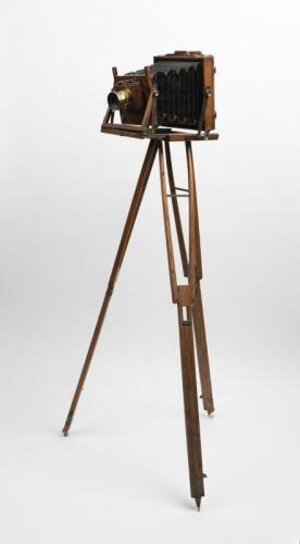 CAMERA: An early timber and brass tripod tailboard style camera