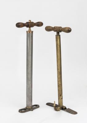 FOOT PUMPS: Two early brass, metal and timber foot pumps