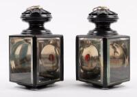 COACH LAMPS: A pair of coach lamps, each lamp has two clear lenses and a small red lens, 23cm high, 12cm wide