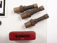 DISPLAY BOARD: A display board consisting of a Champion spark plug sticker, several spark plugs and early tin spark plug containers plus one wrench, 21cm high, 48cm wide - 2