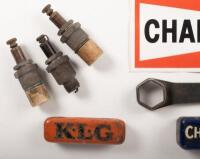 DISPLAY BOARD: A display board consisting of a Champion spark plug sticker, several spark plugs and early tin spark plug containers plus one wrench, 21cm high, 48cm wide - 3