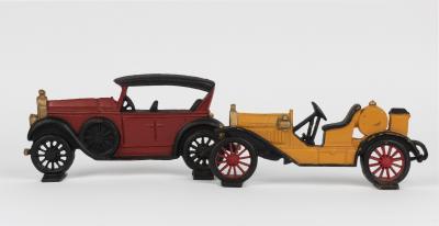 DOOR STOPS: Two modern cast iron door stops in the form of vintage cars