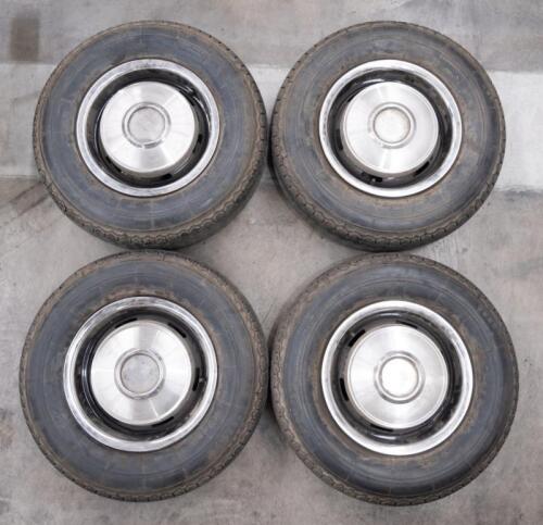 SILVER SHADOW: A set of four circa 1970s Rolls Royce Silver Shadow 15 inch wheels with tyres, wheel rings and hubcaps