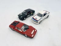 FERRARI: A group of 3 1:43 scale models by Solido including a Ferrari 512 BB, a BMW 3.0 E9 and a Volkswagen Scirocco, all in original packaging. [Location: Sydney]