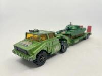 MILITARY:&nbsp;A group of 3 models including a 1:43 1920 Rolls Royce Armoured Car by&nbsp;Matchbox with original packaging, a&nbsp;Battle Kings K106 Truck with tank&nbsp;by Matchbox (no packaging) and a 1:32 1923 Ford Model T US Army truck by Signature models. [Location: Syd - 5