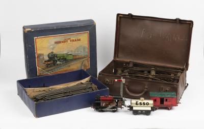 TRAINS: A boxed set including clockwork 0-4-0 '0' Gauge LMS tank engine and goods set