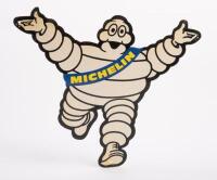 MICHELIN: A Michelin, hard plastic, Bibendum hanging shop display piece, with Bibendum in outward arms pose, 28cm high, 32.5cm wide