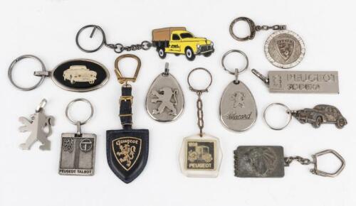 PEUGEOT: Collection of twelve Peugeot keyrings of various ages