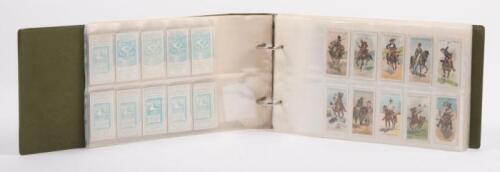 86 · CIGARETTE CARDS: An album containing transport themed cigarette cards