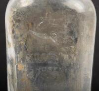 GLASS BOTTLES: Two glass bottles, including a Laurel Kerosene 'Vacuum Oil Company' bottle and a one imperial pint embossed glass oil bottle with Energol tin top - 2