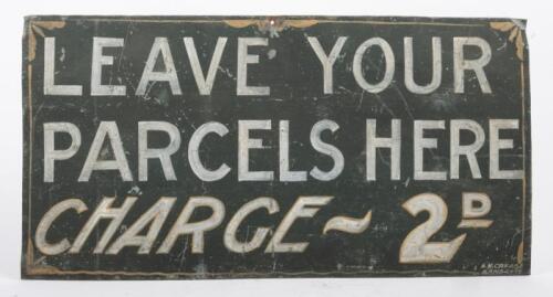 139 · TIN SIGN: A hand painted tin sign with 'Leave Your Parcels Here' written in white paint over green background