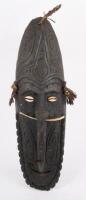 SOUTH PACIFIC TRIBAL MASK: A South Pacific hand carved timber tribe mask with inset shell eyes and bone through nose