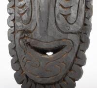 SOUTH PACIFIC TRIBAL MASK: A South Pacific hand carved timber tribe mask with inset shell eyes and bone through nose - 2