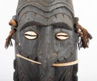 SOUTH PACIFIC TRIBAL MASK: A South Pacific hand carved timber tribe mask with inset shell eyes and bone through nose - 3